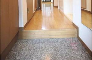 Japanese house enters a steps leading up to a hous