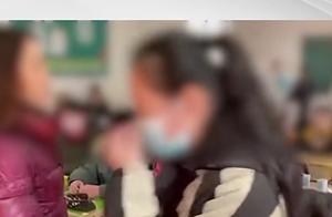 1月12日，武汉女老师让学生排队挨手板