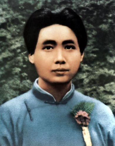 1951�꣬һλ��ũָ��ë��ϯ��ɫФ���վ����������ҵı�